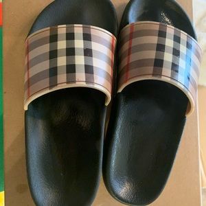 Little girl size ( 32 ) Burberry slides .